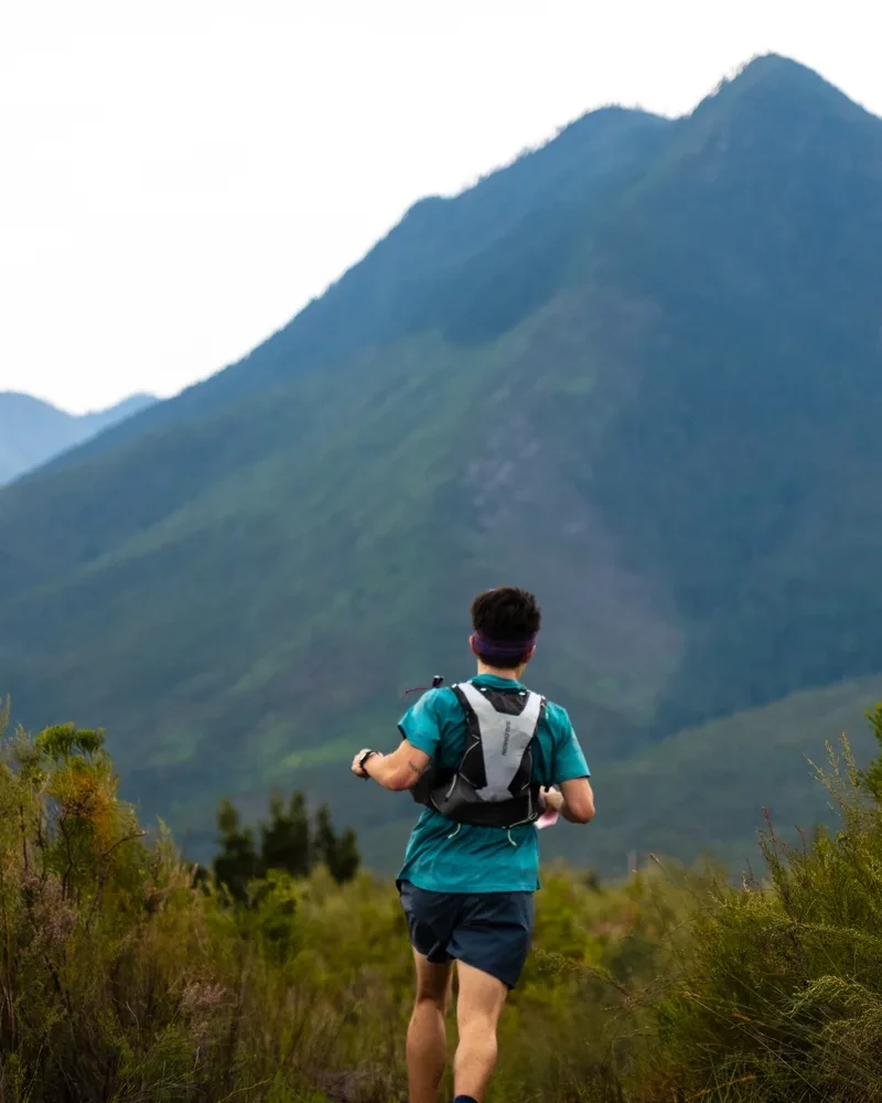 Trail runner on a mountain trail in the Tsitsikamma